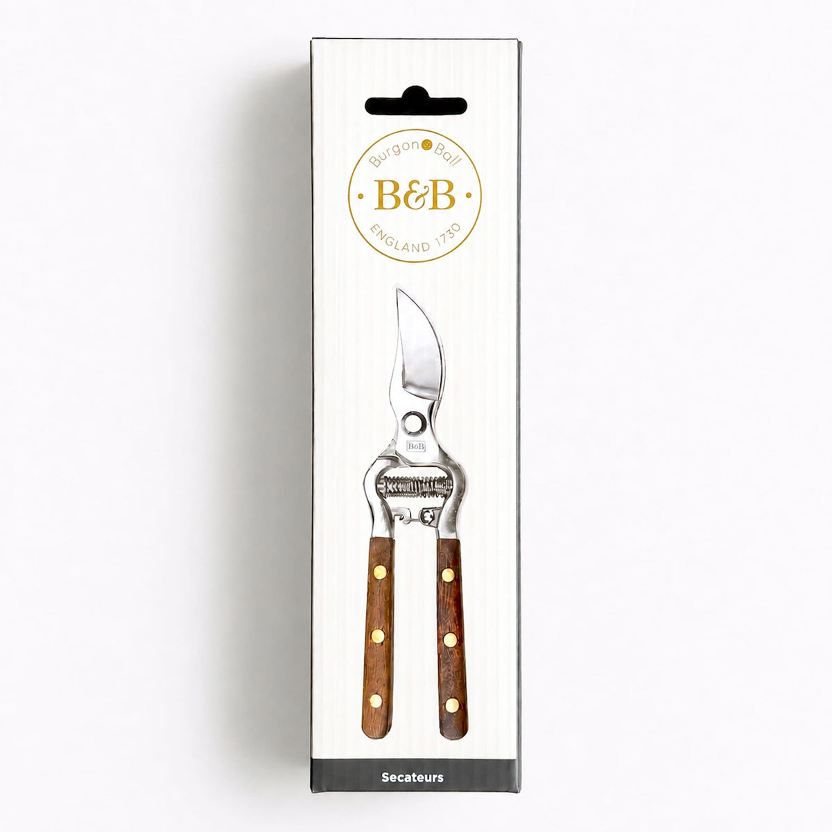 B&B England garden shears in their original white hanging retail box, showing the silver metal shears with brown wooden handles and brass rivets printed on the front.