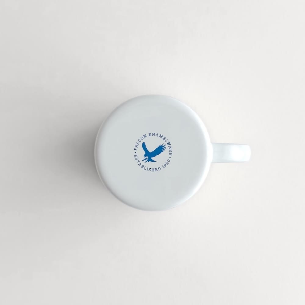 Underside view of a white Falcon enamelware mug with authenticity logo stamp