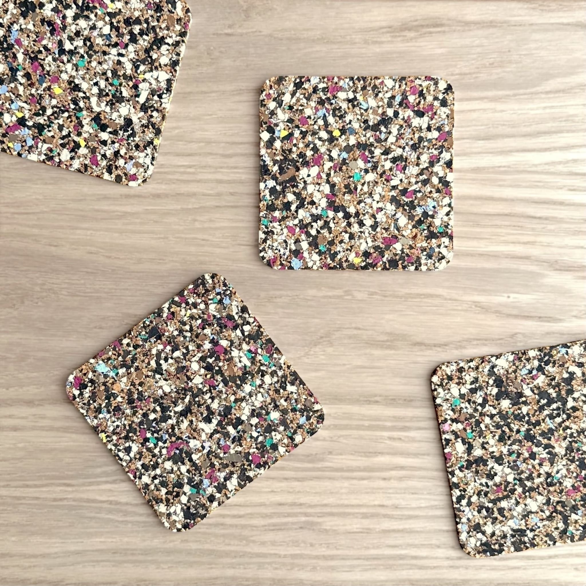 Speckled coaster set on a wooden surface